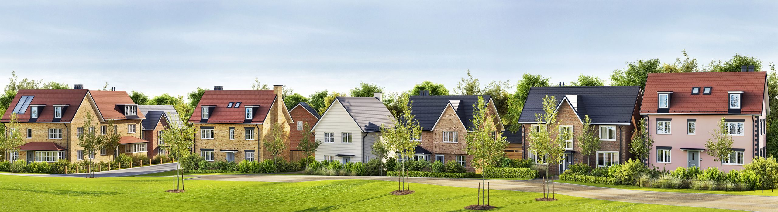 A row of new-build family houses behind a village green